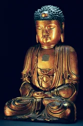Eine Figur des sitzenden Buddha (Goldlack)