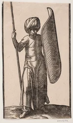 Stehender Soldat mit Turban, von vorne gesehen; in seiner rechten Hand ein Speer; auf seinem linken Arm ein gebogener Schild