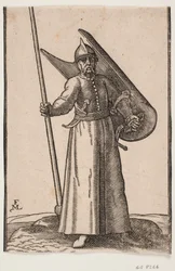 Stehender Soldat mit Helm auf dem Kopf; in der rechten Hand eine Lanze, deren Spitze außerhalb der oberen Einrahmungslinie ist; am linken Arm ein gekrümmter Schild, der von innen zu sehen ist; im Gürtel unter dem rechten Arm ein gekrümmter Dolch, an der li
