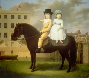 Zwei Kinder auf einem schwarzen Pony sitzend