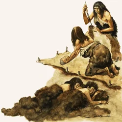 Eine Steinzeitfamilie schabt Felle, um Kleidung herzustellen