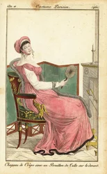 Frau sitzt auf einem Empire-Stuhl in einem Salon, Paris