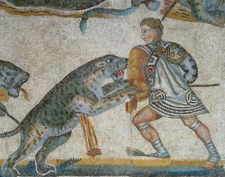 Mosaik mit einer Szene einer wilden Jagd, (Detail) eines Gladiators, der ein wildes Tier tötet