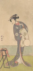 Der erste Nakamura Tomijuro als Oiran in einem Raum stehend