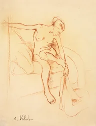 Nackte Frau auf einem Bett sitzend