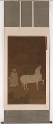 Zentralasiatischer Bräutigam, der ein Pferd weidet