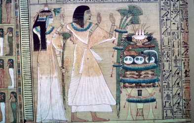 Darstellung eines Mannes und seiner Frau, die Osiris Opfergaben darbringen
