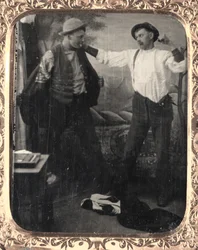 Zwei Männer inszenieren einen Kampf in einem Studio, um 1860