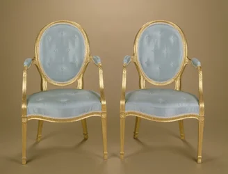 Paar Adam-Stühle mit ovaler Rückenlehne, vergoldet, blau gepolstert, um 1780