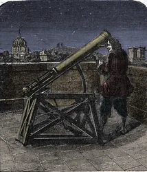 Isaac Newton (1642-1727), englischer Physiker, benutzt sein Teleskop.