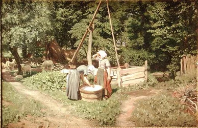Junge Mädchen am Brunnen