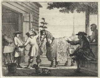 Händler bei einem reich verzierten Pferd