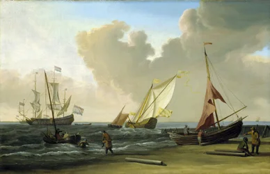Fischerboot zieht seine Netze am Strand im Wind, an der niederländischen Küste