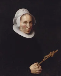 Eine Dame, die ein Kruzifix hält