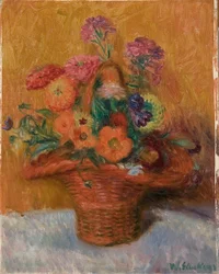 Roter Korb mit Zinnien